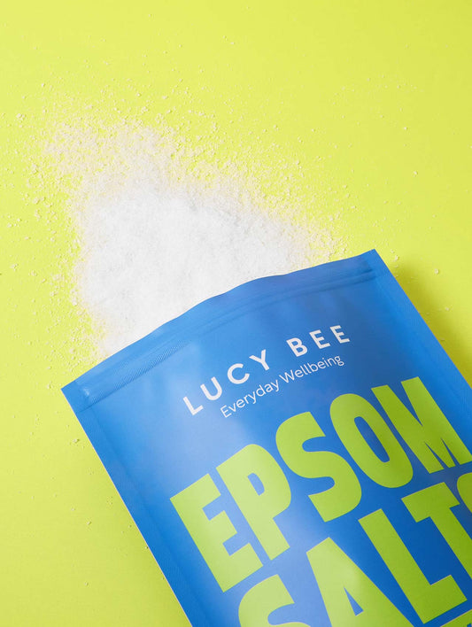 Lucy Bee Epsom Salt packet on a yellow background rich in magnesium