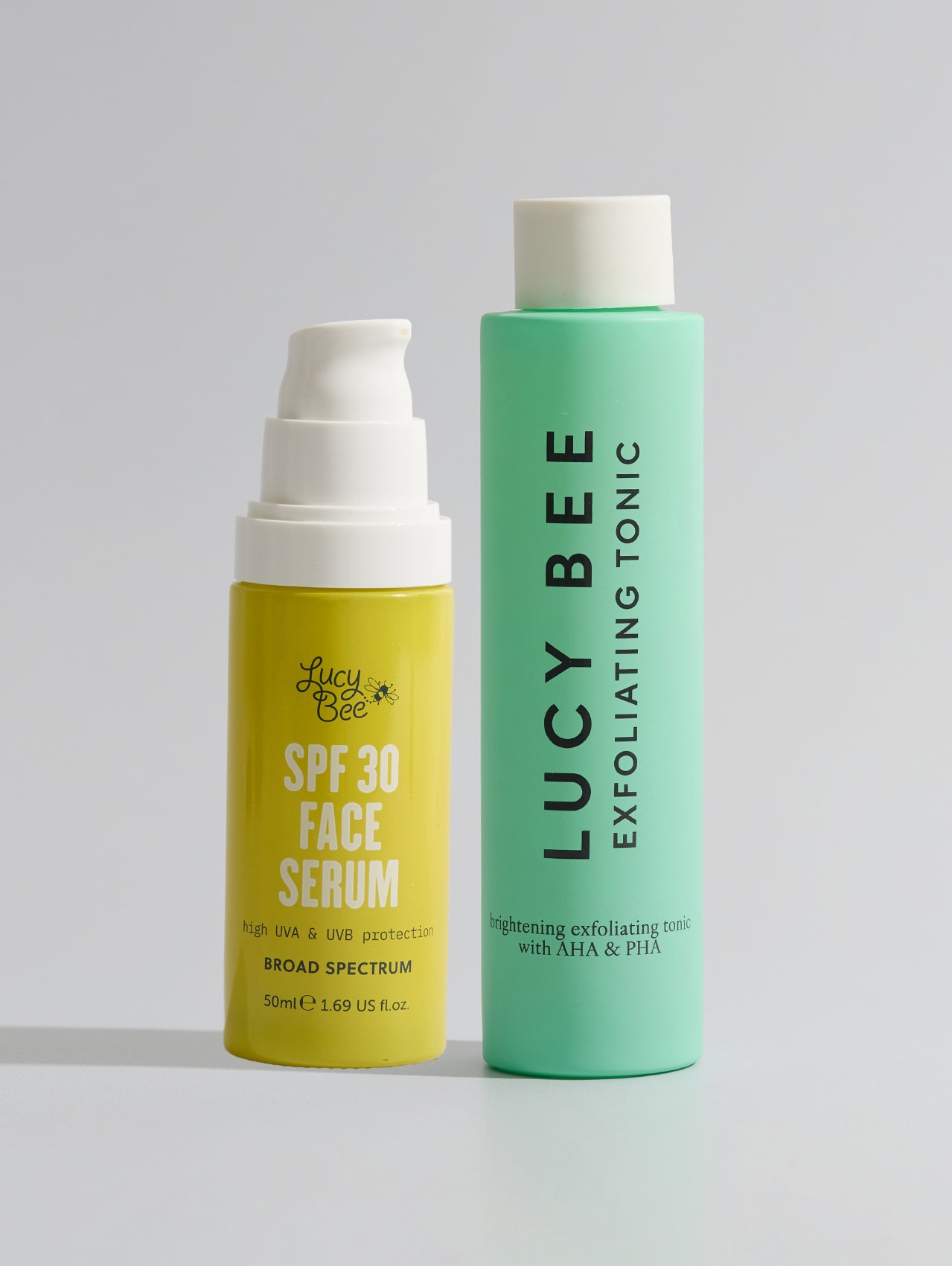 Two skincare products from Lucy Bee on a light gray background