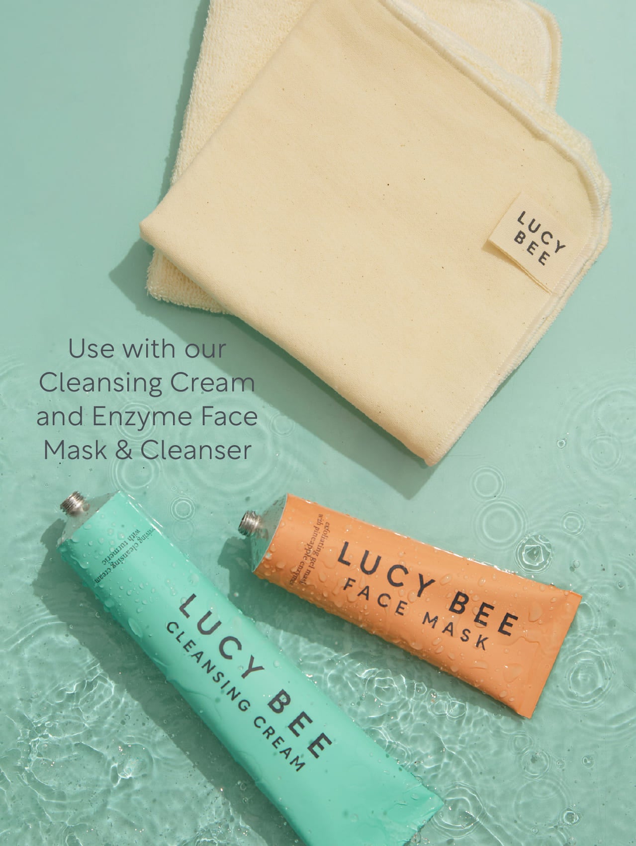 Lucy Bee face mask and cleansing cream on a textured green background