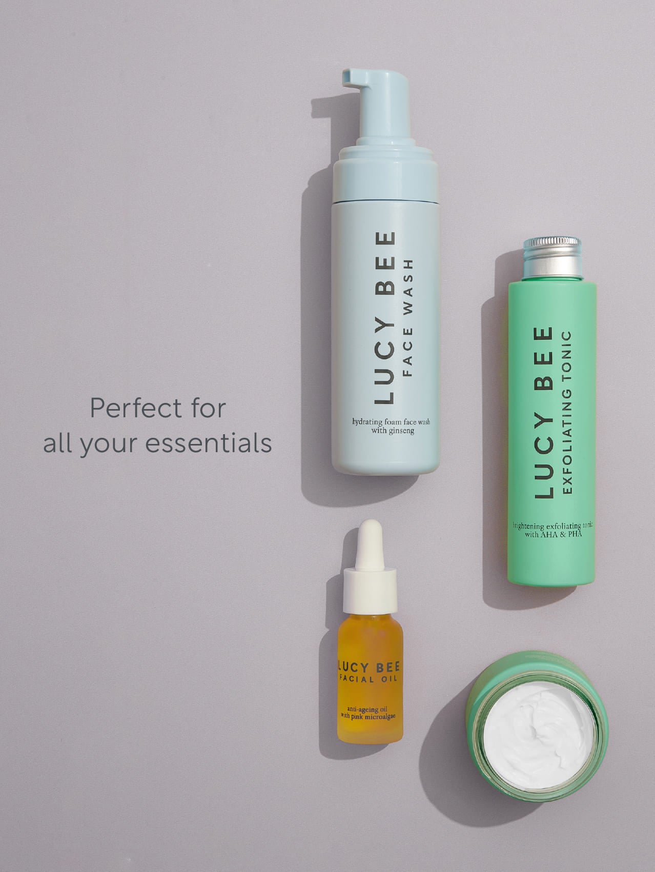 Lucy Bee skincare products on a gray background