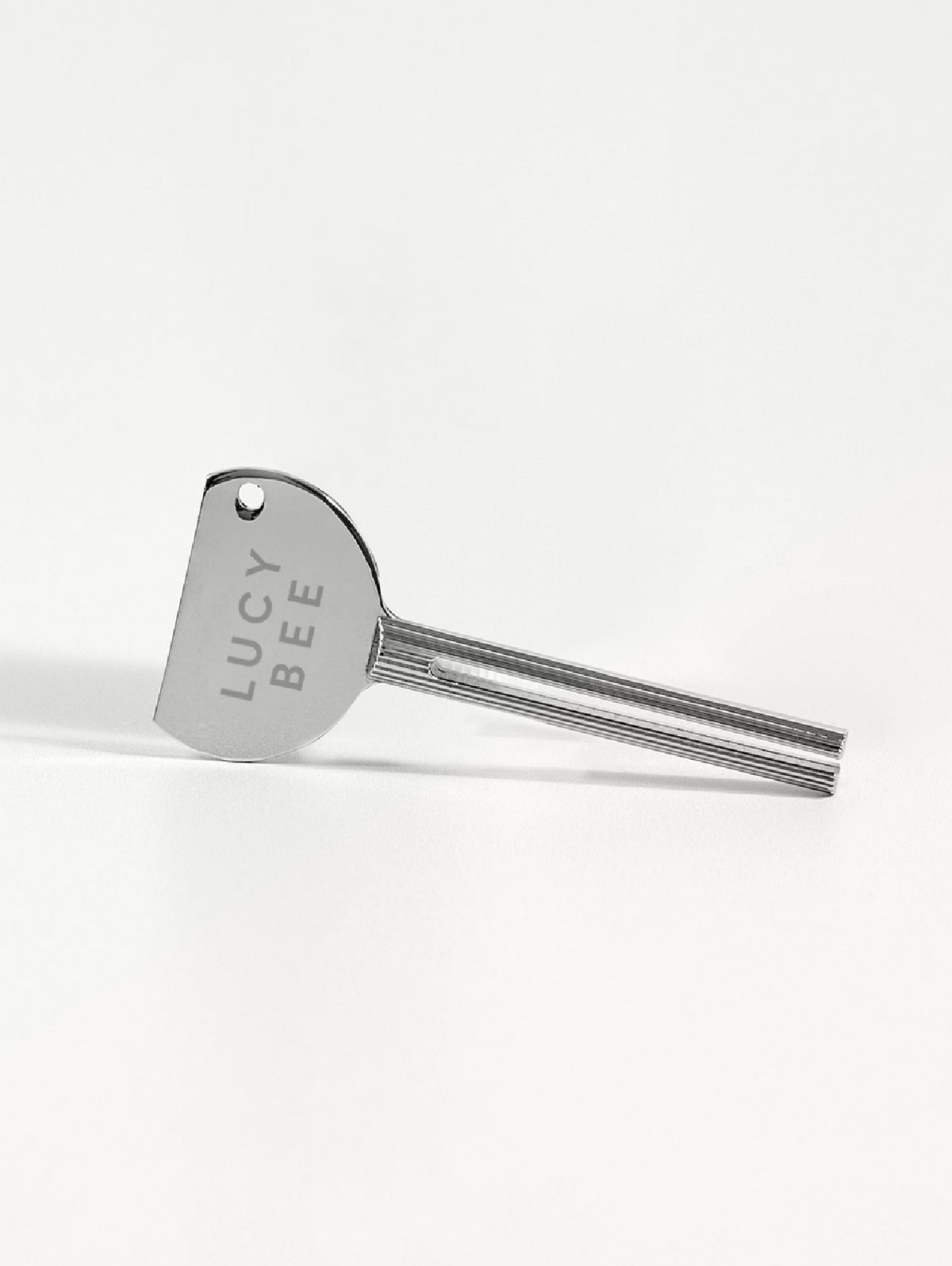 Stainless steel Lucy Bee Tube Turner tool on a white background
