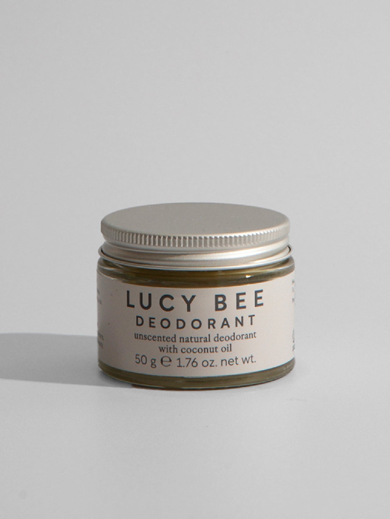 Lucy Bee deodorant jar on a light gray background