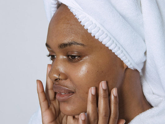 Close-up of SPF sunscreen application to face for sun protection