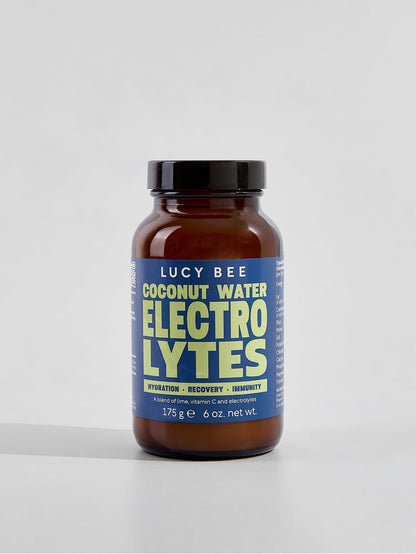 Lucy Bee coconut water electrolytes supplement bottle on a white background. Lucy Bee electrolyte powder UK with coconut water