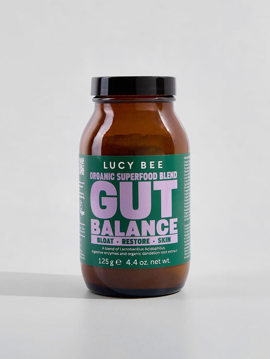 Lucy Bee Gut Balance supplement bottle on a white background. lucy bee organic gut balance for digestive support with prebiotics, probiotic and digestive enzymes