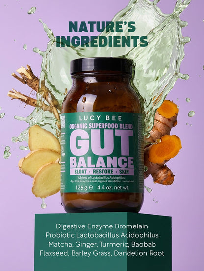 Lucy Bee Gut Balance supplement bottle with nature-themed elements on a purple background. lucy bee organic gut balance for digestive support with prebiotics, probiotic and digestive enzymes