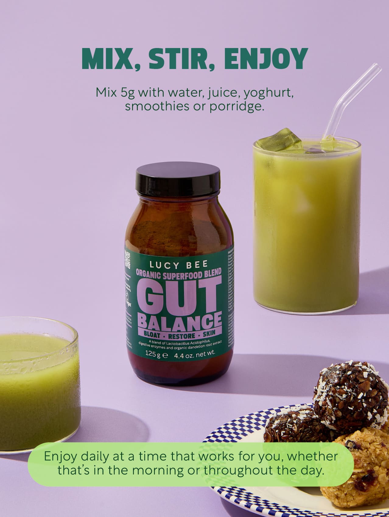 Lucy Bee Gut Balance supplement bottle with a glass of green juice and cookies on a purple background. lucy bee organic gut balance for digestive support with prebiotics, probiotic and digestive enzymes