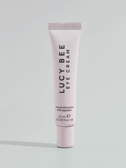 Lucy Bee eye cream tube on a light gray background