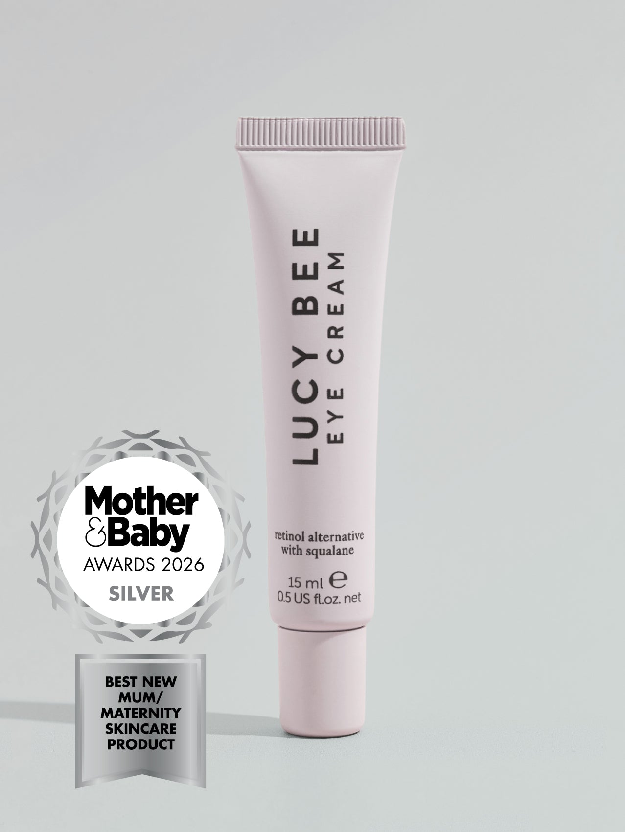 Lucy Bee eye cream with Mother & Baby Awards 2026 silver badge on a light gray background