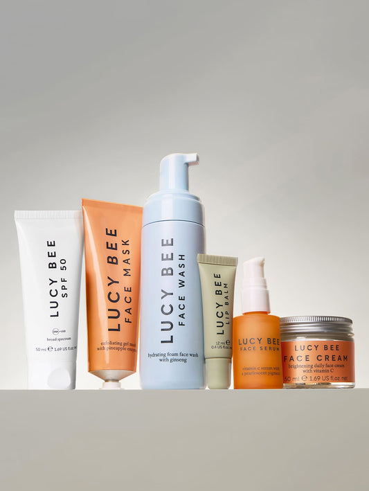 Set of Lucy Bee skincare products on a gray background morning skincare routine