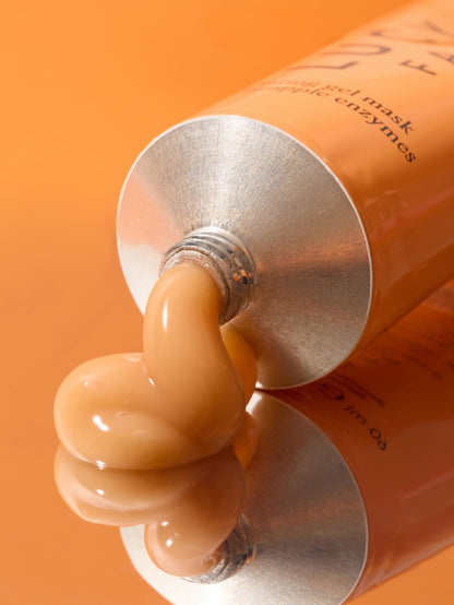 Tube of facial mask being squeezed