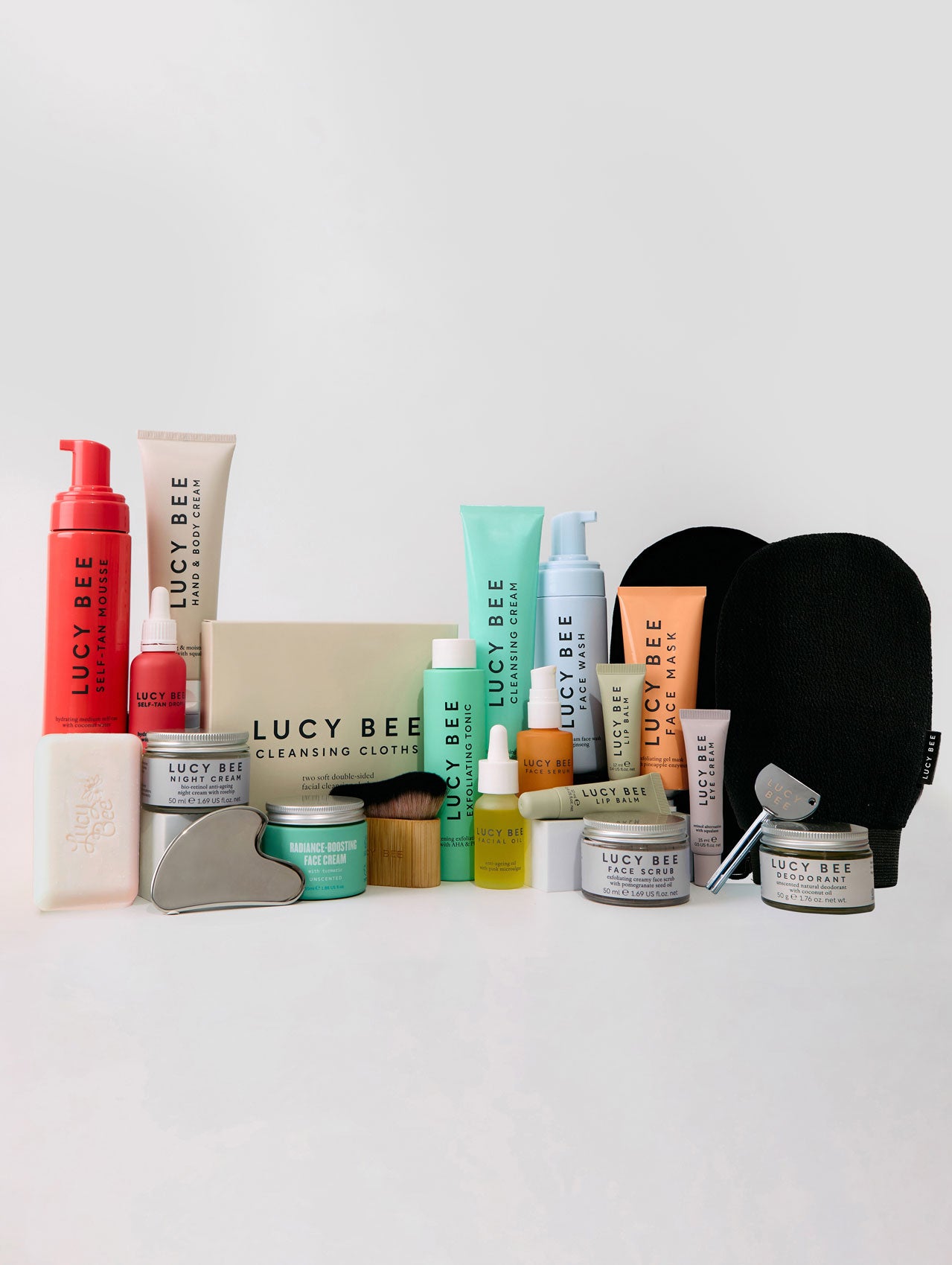 Collection of Lucy Bee skincare products on a white background