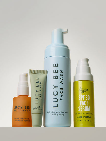 Collection of Lucy Bee skincare products on a white background