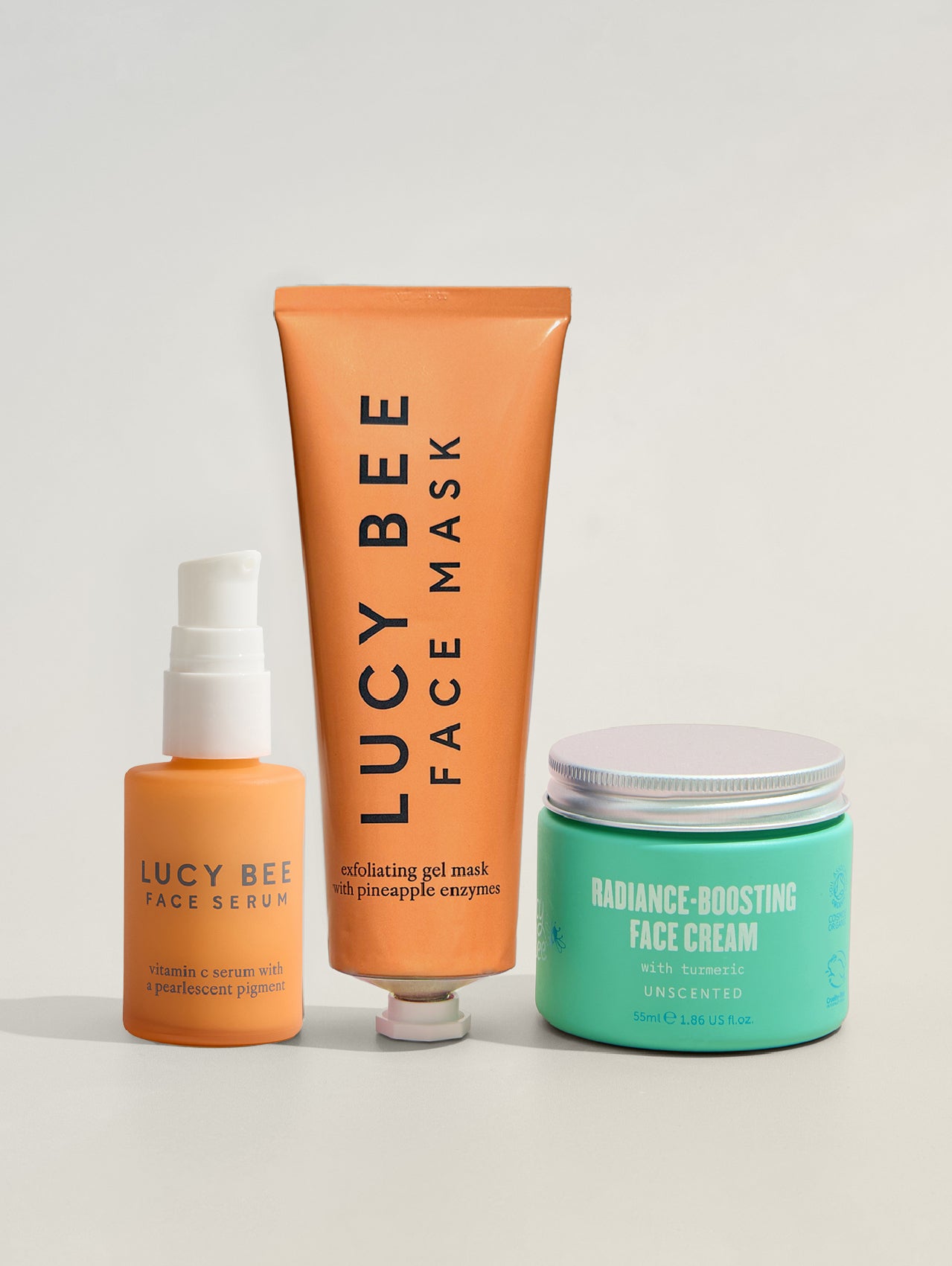 Three lucy bee skincare products on a light gray background