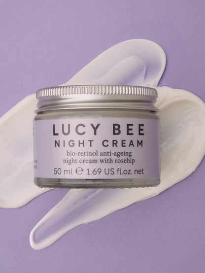 Jar of Lucy Bee night cream with a purple background