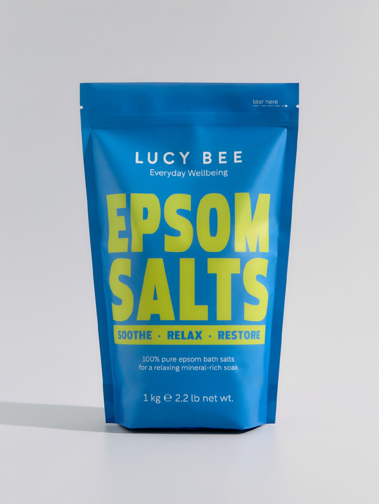 Blue package of Lucy Bee Epsom Salts on a white background