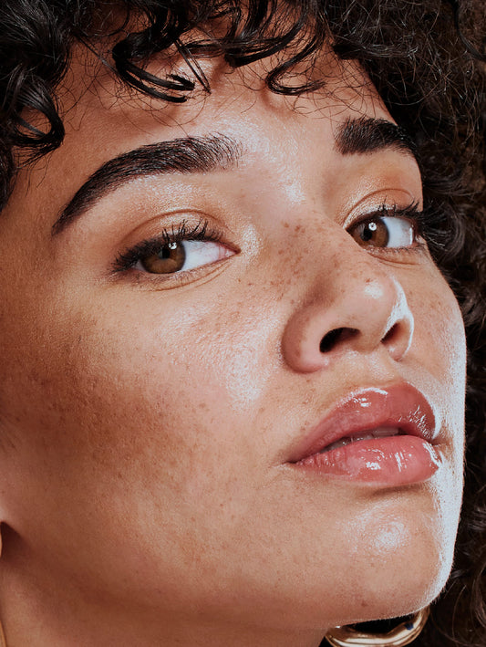 Close-up of a person's face with a soft focus on the skin texture.