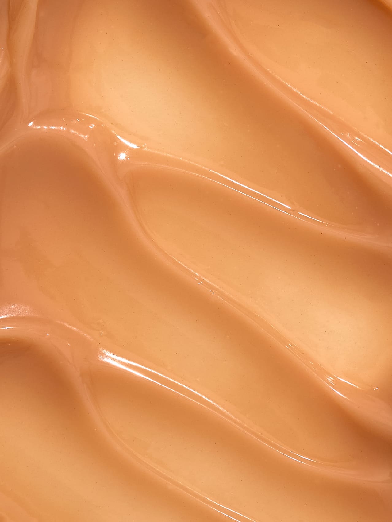 Close-up of smooth glossy lucy bee enzyme face mask