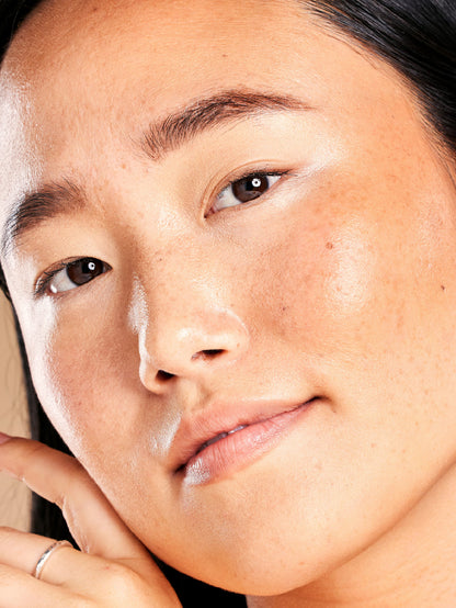 Close-up of a person's face with a soft focus on the skin texture.