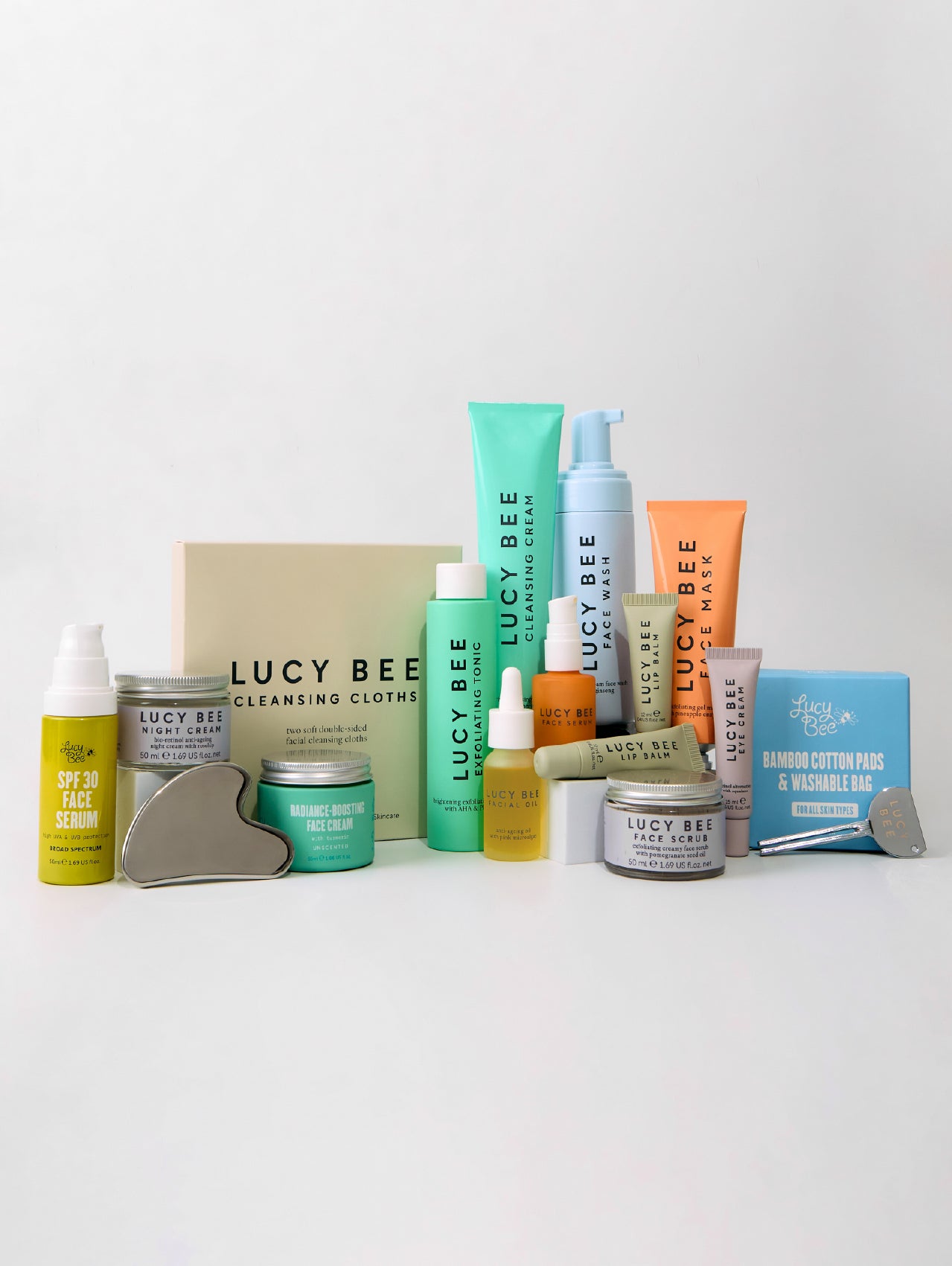 Collection of Lucy Bee skincare products on a white background