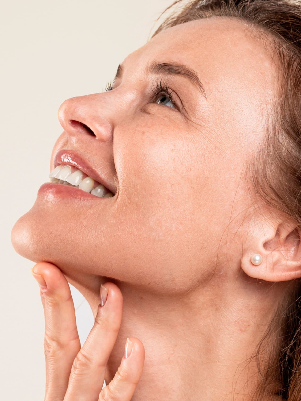 Close-up of a woman's face with a neutral background