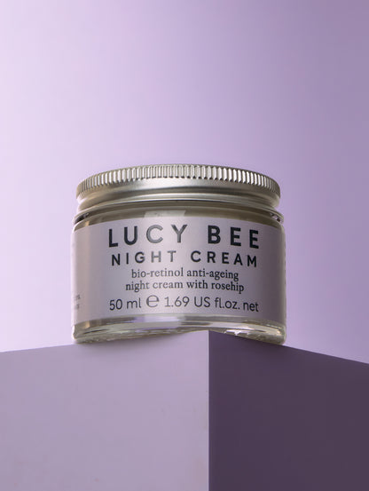 Jar of Lucy Bee Night Cream on a purple background