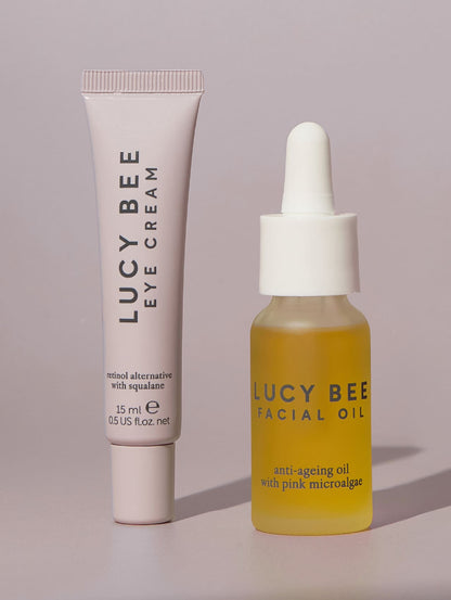 Lucy Bee eye cream and facial oil on a light gray background