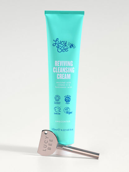 Tube of Lucy Bee Reviving Cleansing Cream with a silver tube turner on a white background