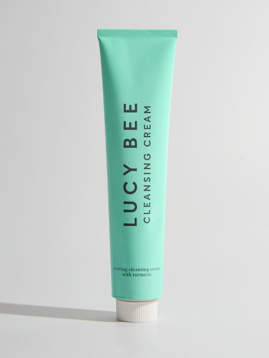 Tube of Lucy Bee cleansing cream on a light gray background