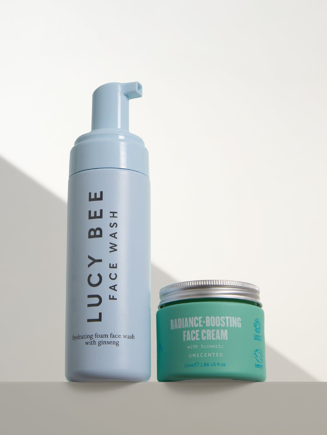 Lucy Bee natural face wash and natural face cream on a light background