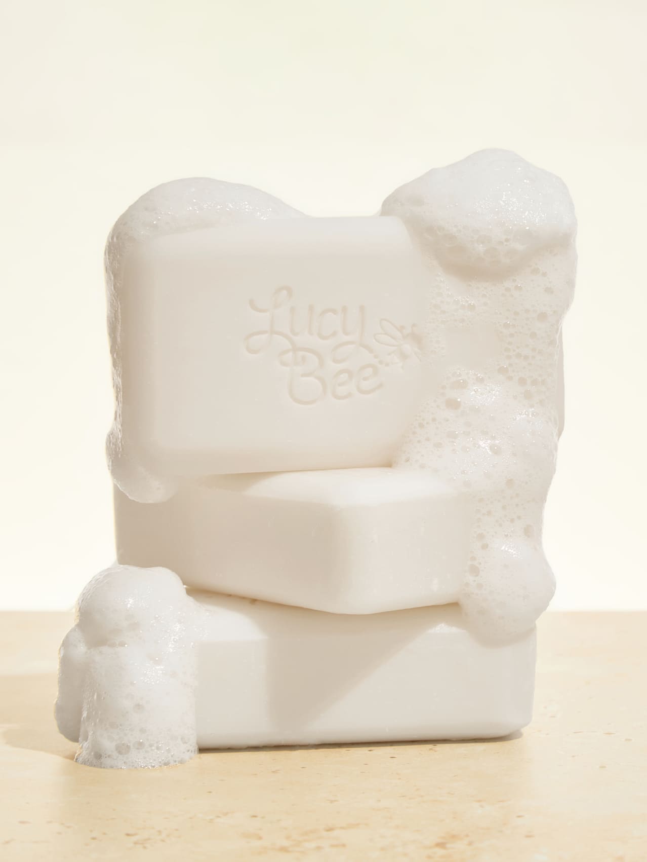 Lucy bee soap bar on a beige background