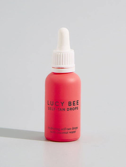 lucy bee self-tan drops on grey background