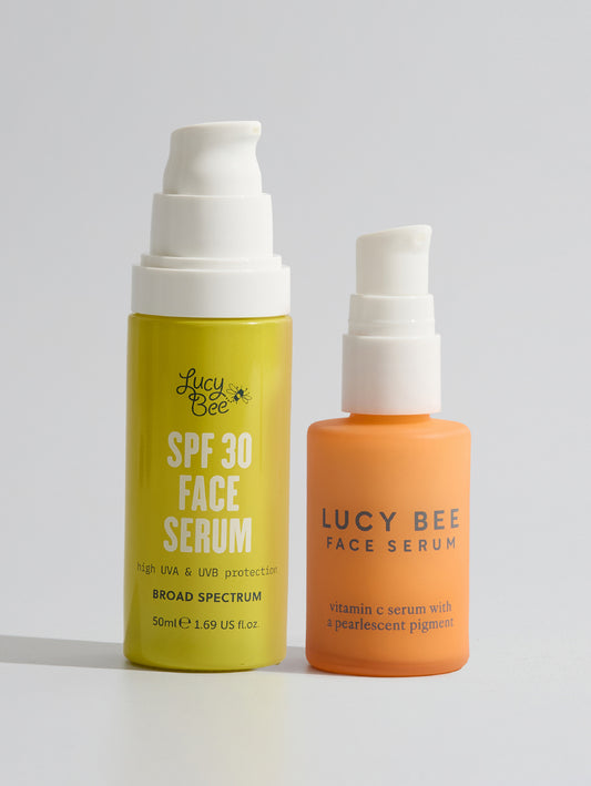bottles of Lucy Bee spf face serum and vitamin c face serum