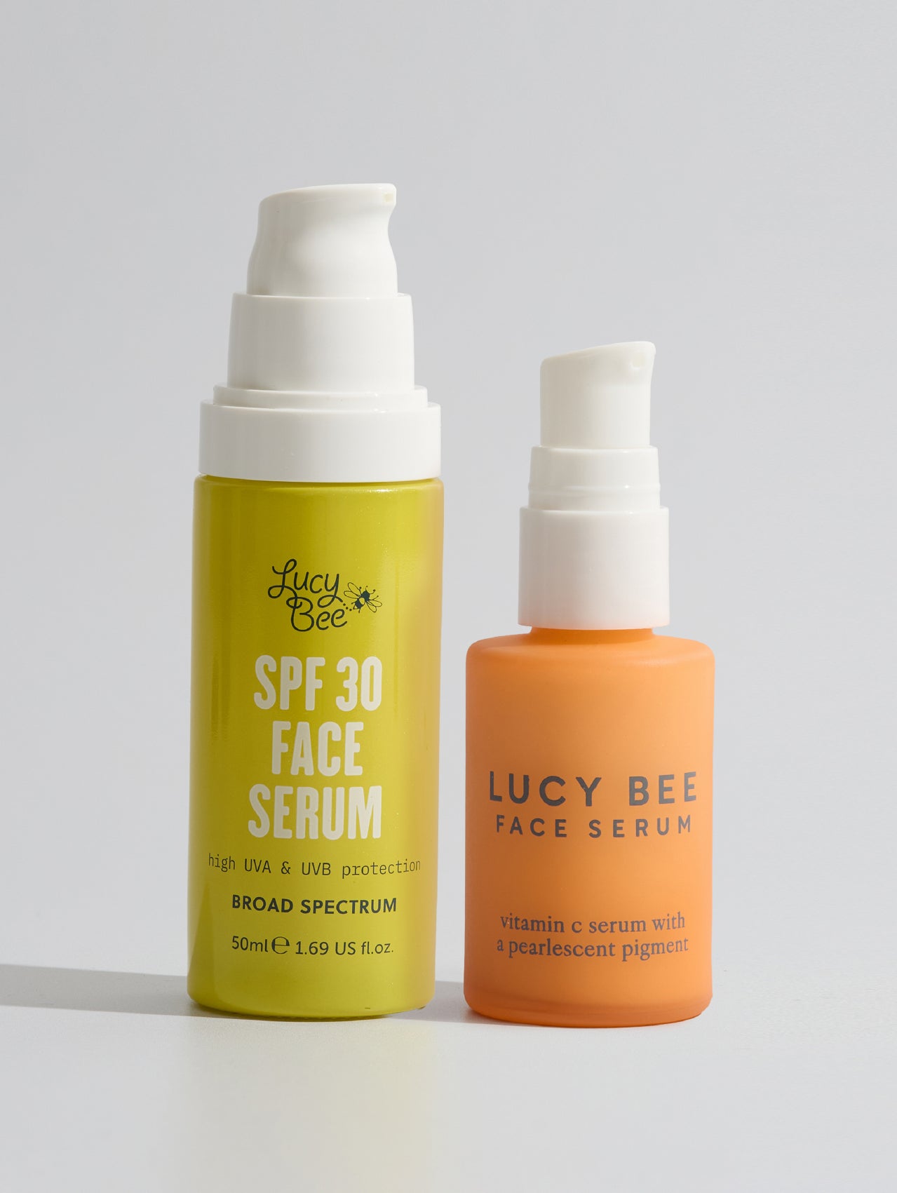 bottles of Lucy Bee spf face serum and vitamin c face serum