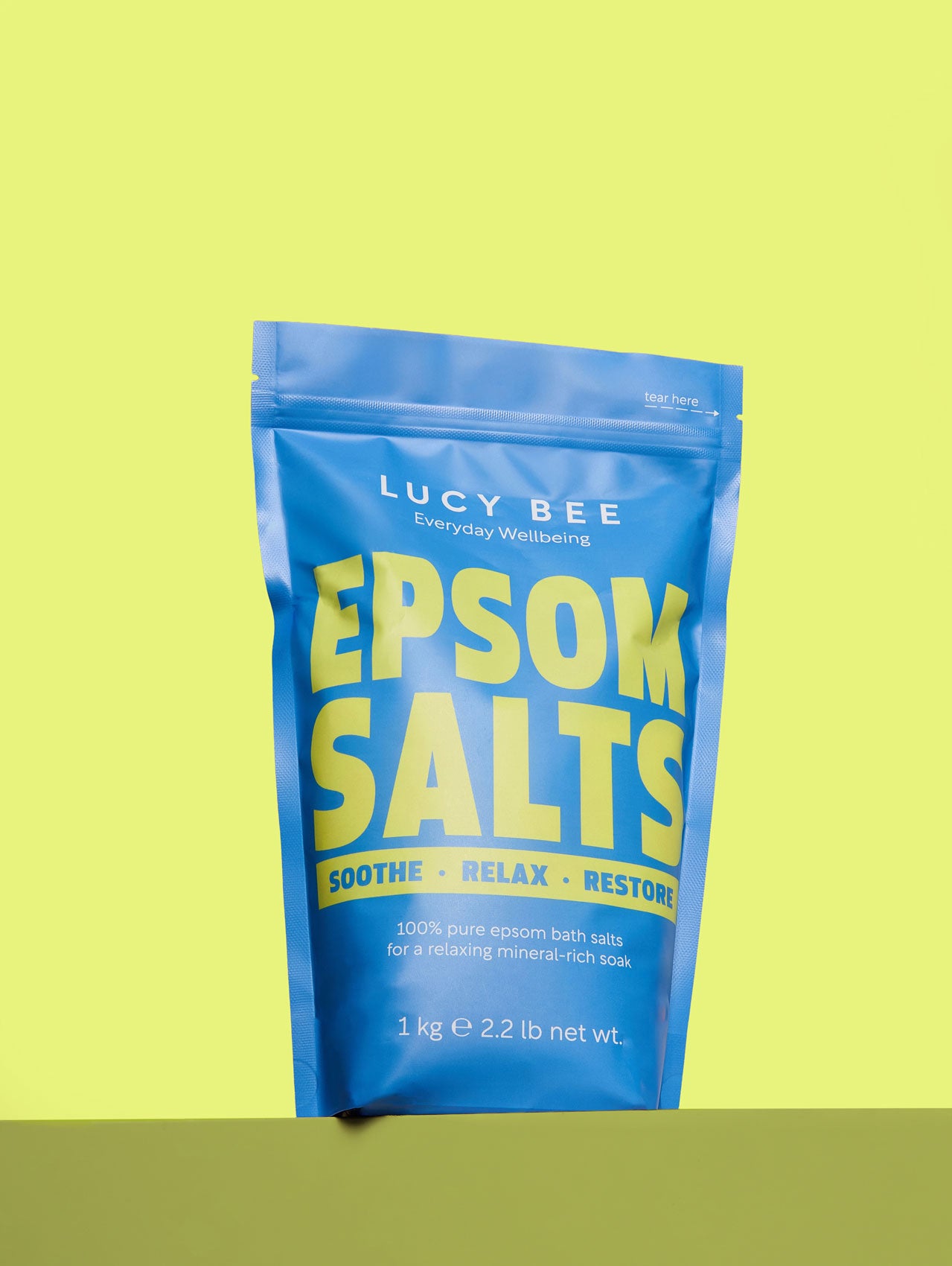 Lucy Bee Epsom Salt packet on a yellow background rich in magnesium 